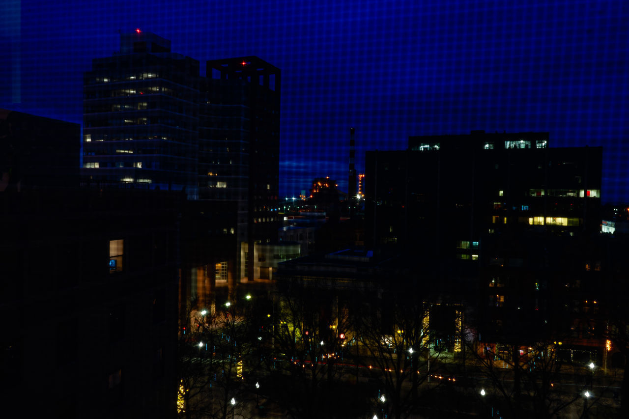 ILLUMINATED BUILDINGS AT NIGHT