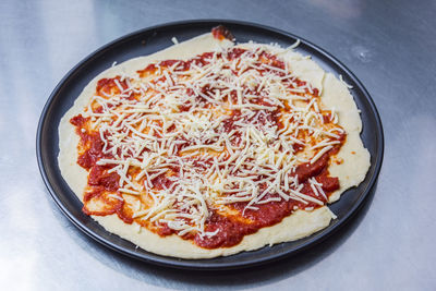 High angle view of pizza served on plate