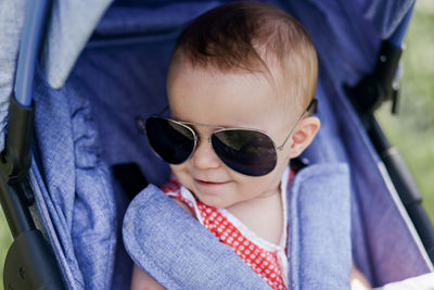 Portrait of cute baby girl wearing sunglasses