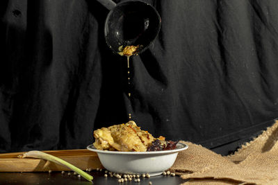 Close-up of meat in bowl on table