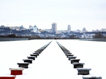 View of buildings in city against clear sky