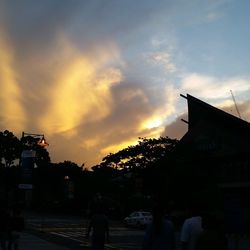 View of buildings against sky at sunset