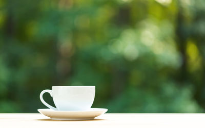 Close-up of coffee cup on table