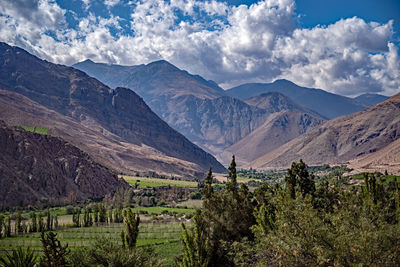 Scenic view of landscape and mountains against sky