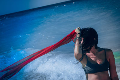 Rear view of woman on boat in sea