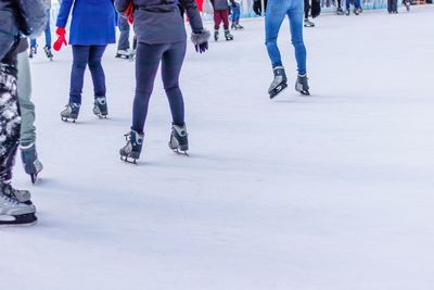 Low section of people on snow