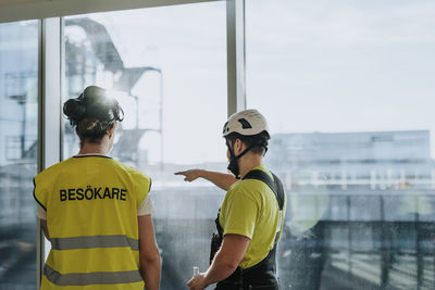 People talking at construction site