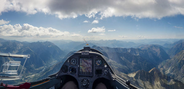 Aerial view of landscape against cloudy sky