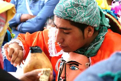 Dancer eating food during traditional festival