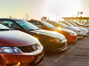 Cars in parking lot against sky