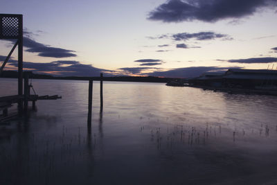 Reflection of clouds in sea at sunset