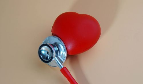 Close-up of toy on table against wall