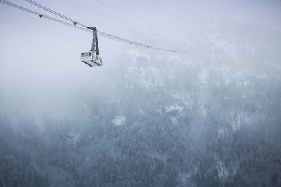 Cable car from the winter sports resort of vaujany leading to the grandes rousses massif 