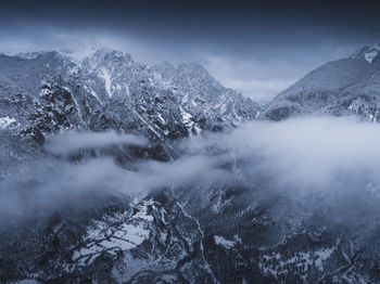 Snow covered mountains against sky