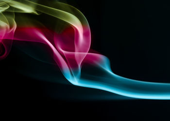 Close-up of light painting against black background