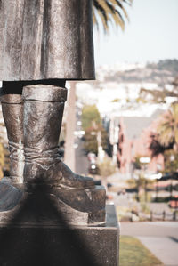 Close-up of old sculpture against building