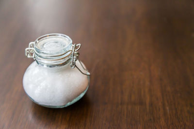 Close-up of glass jar on table