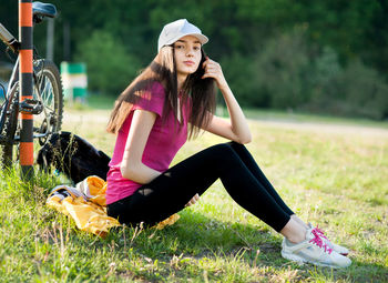 Woman with umbrella on field