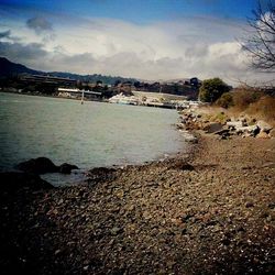 Scenic view of sea against cloudy sky