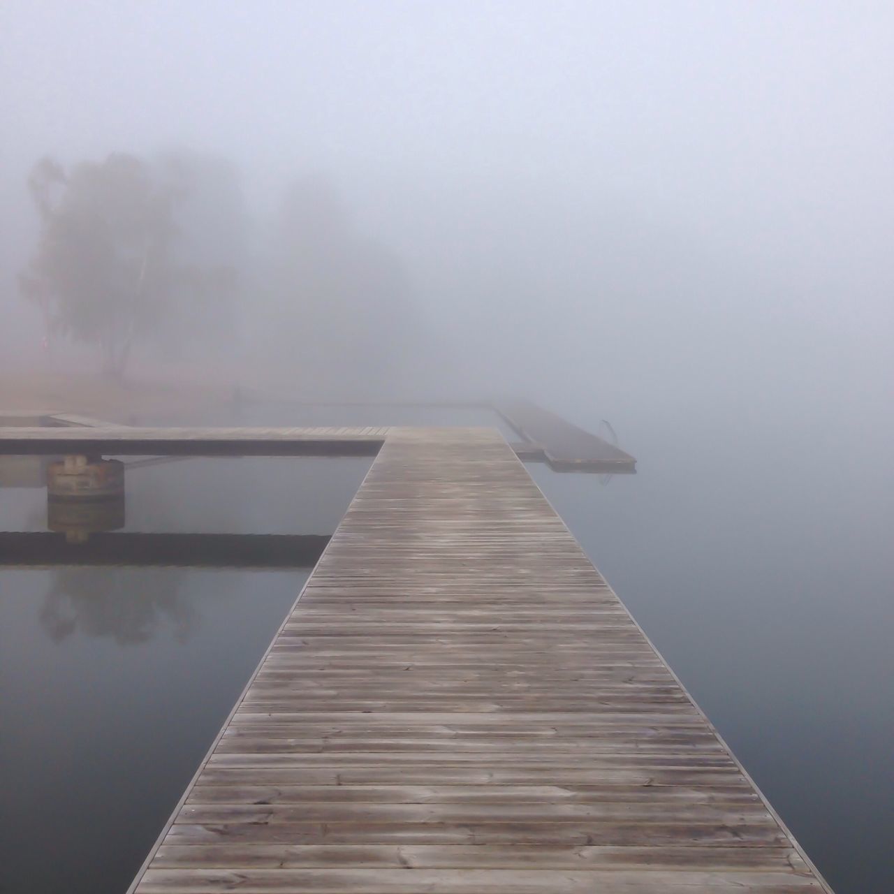 water, fog, copy space, tranquility, tranquil scene, foggy, lake, pier, scenics, nature, sky, beauty in nature, sea, waterfront, weather, wood - material, day, jetty, calm