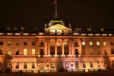 Facade of historic building at night