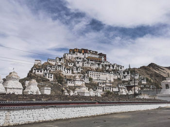 Buildings in city against sky