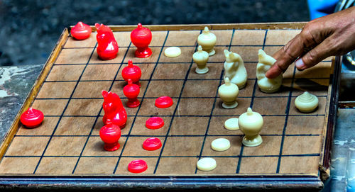 Close-up of hand playing chess