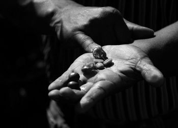 Close-up of man holding hands