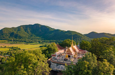 High angle view of building and mountains against sky