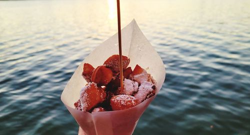 Close-up of hand holding ice cream