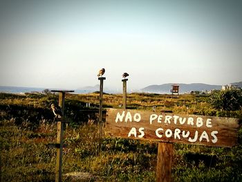 Information sign against clear sky