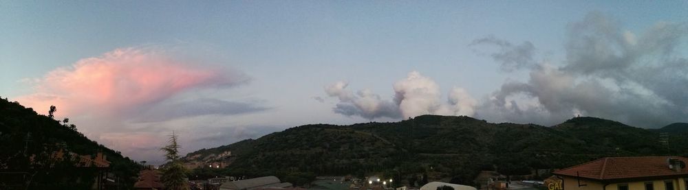 View of mountain range against cloudy sky