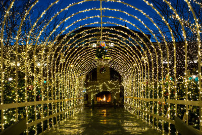 Illuminated chandelier hanging at night