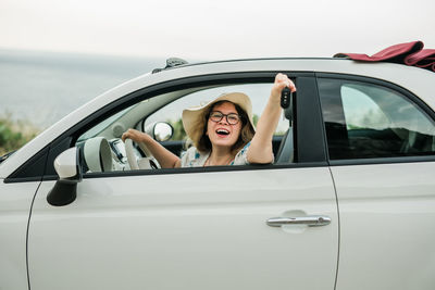 Side view of woman in car