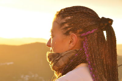 Side view of woman with braided hair