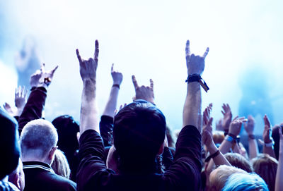 Rear view of crowd enjoying during music concert