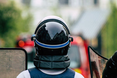 Rear view of man cycling