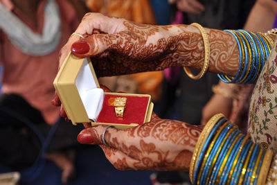 Close-up of woman holding hands