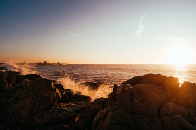 Scenic view of sea against sky during sunset