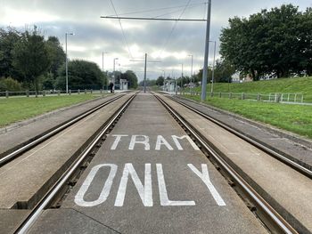 Text on road against sky