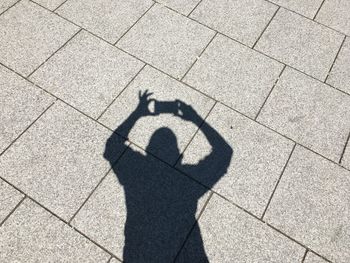 Shadow of man on hand