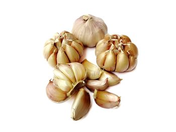 Close-up of garlic against white background