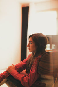 Side view of young woman looking away