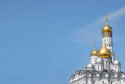 Low angle view of traditional building against blue sky