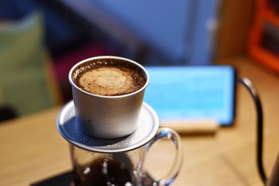 Close-up of coffee cup on table