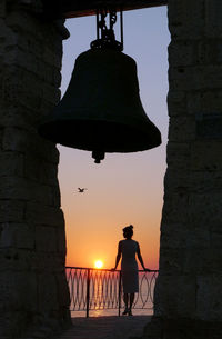 Silhouette of people at sunset