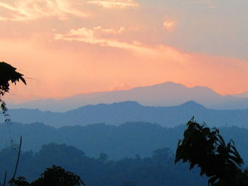 Scenic view of mountains against dramatic sky