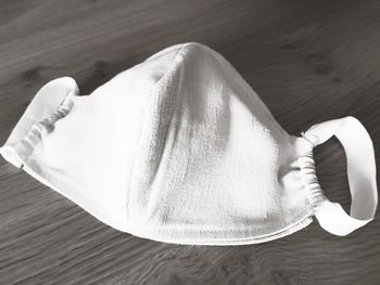 High angle view of human feet on table