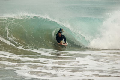 Man surfing in sea