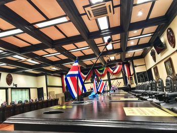 Multi colored flags hanging from ceiling